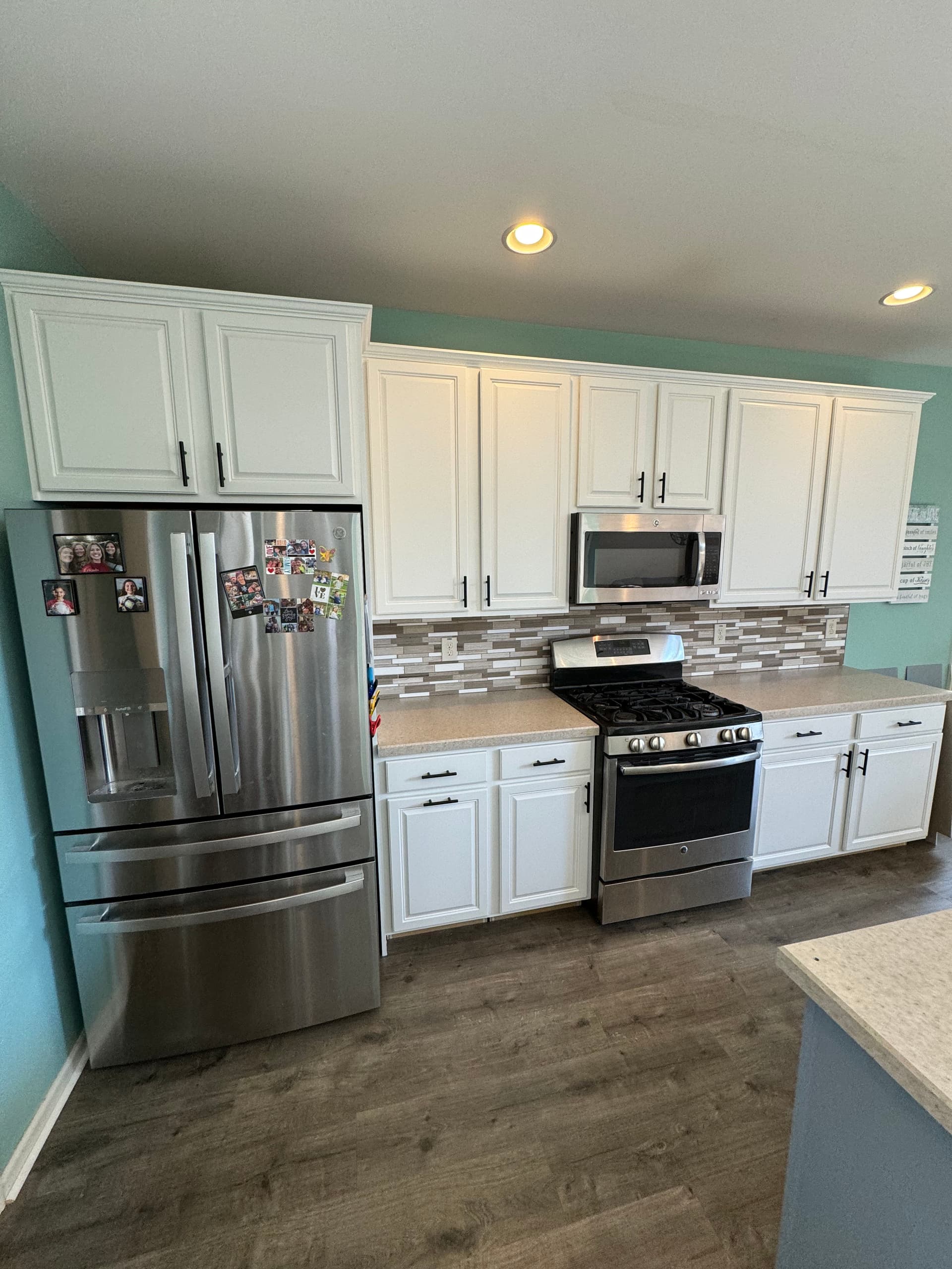 Kitchen Cabinet Makeover Transforms Space with Modern White Finish