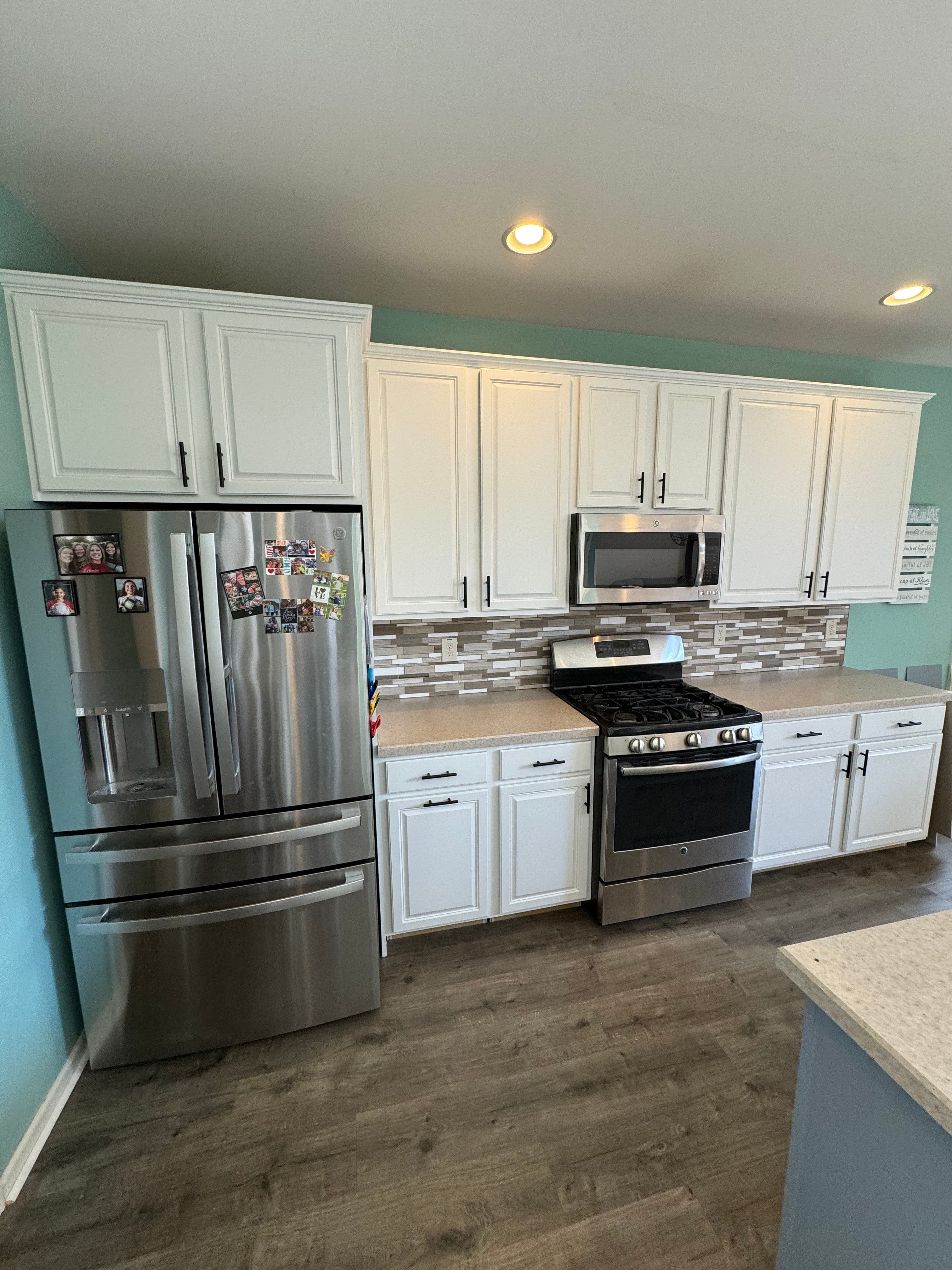 Project Kitchen Cabinet Makeover Transforms Space with Modern White Finish image