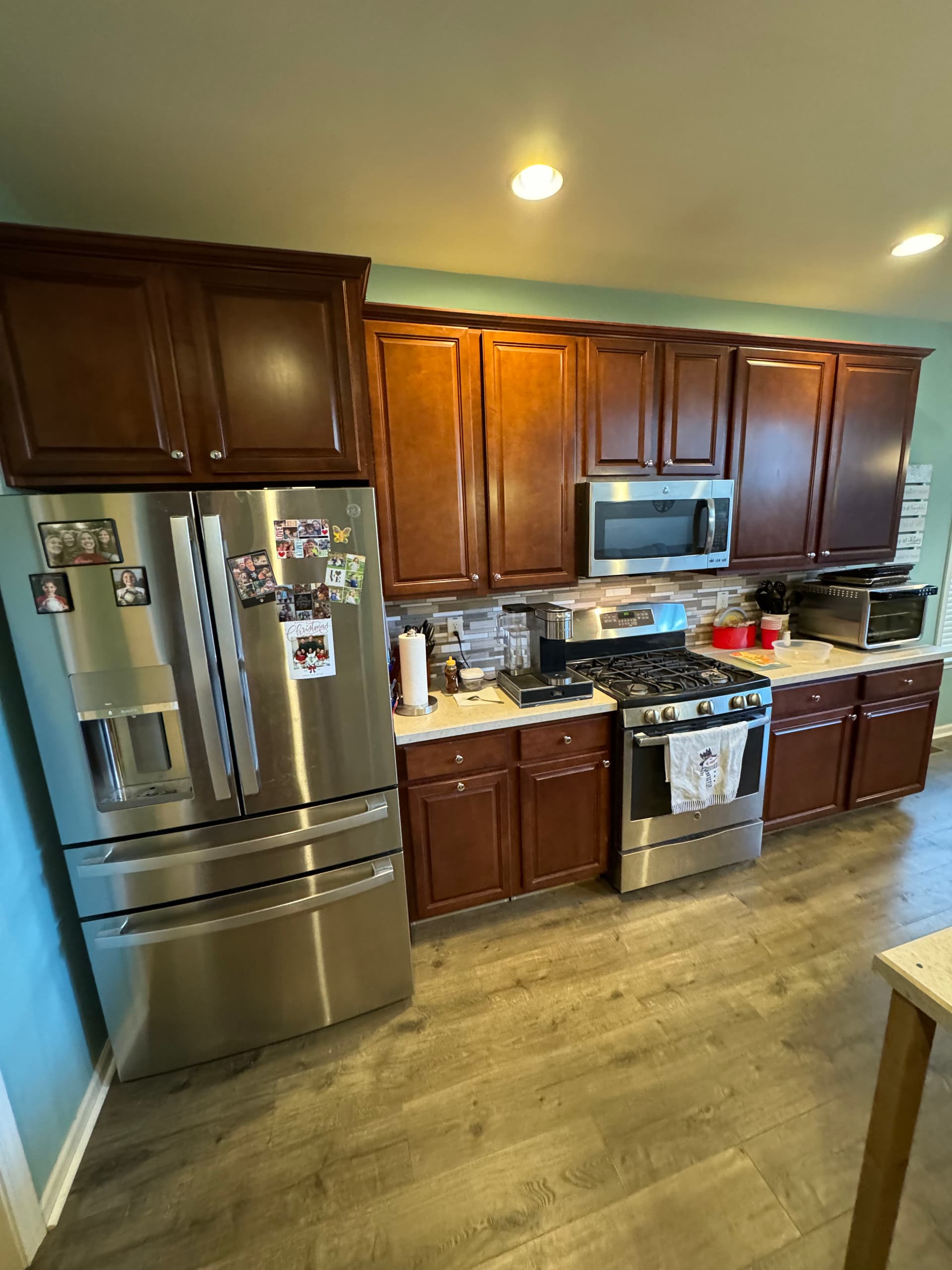 Kitchen Cabinet Makeover Transforms Space with Modern White Finish